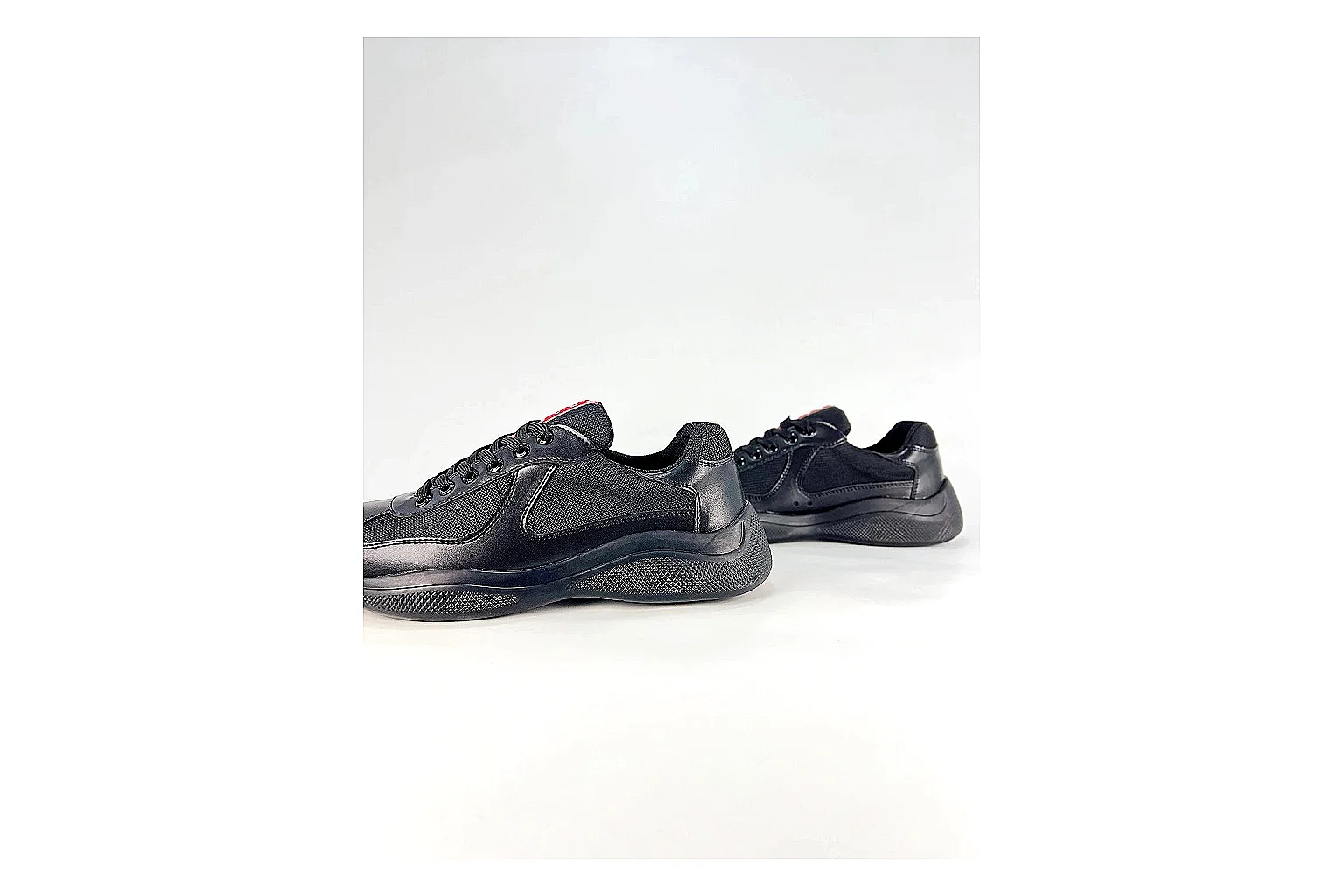 Black Runner Black Sneaker comparison photo showing black mesh runner upper, tonal overlays, modern running shape, and dark cushioned sole thumbnail 3