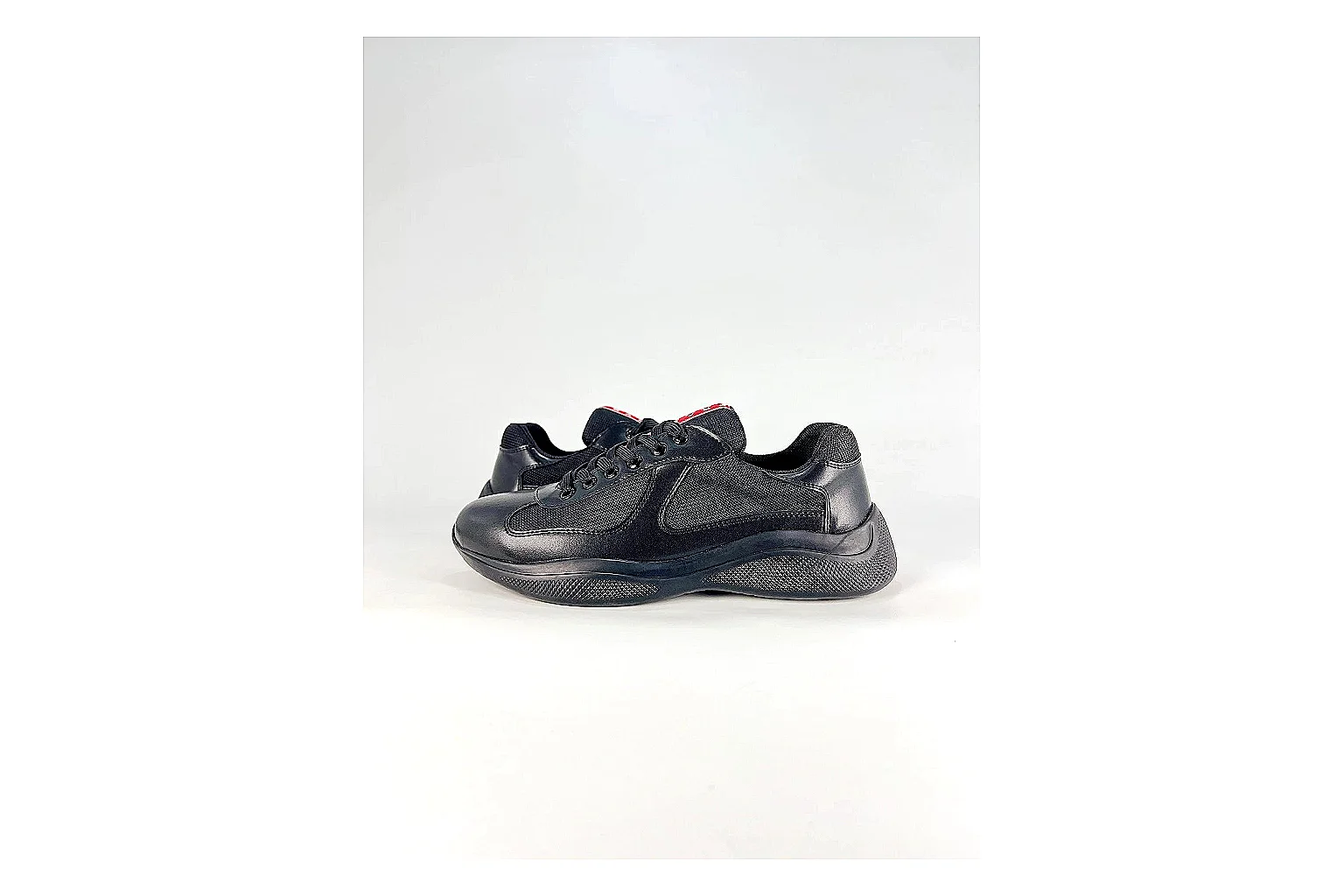 Black Runner Black Sneaker comparison photo showing black mesh runner upper, tonal overlays, modern running shape, and dark cushioned sole thumbnail 6