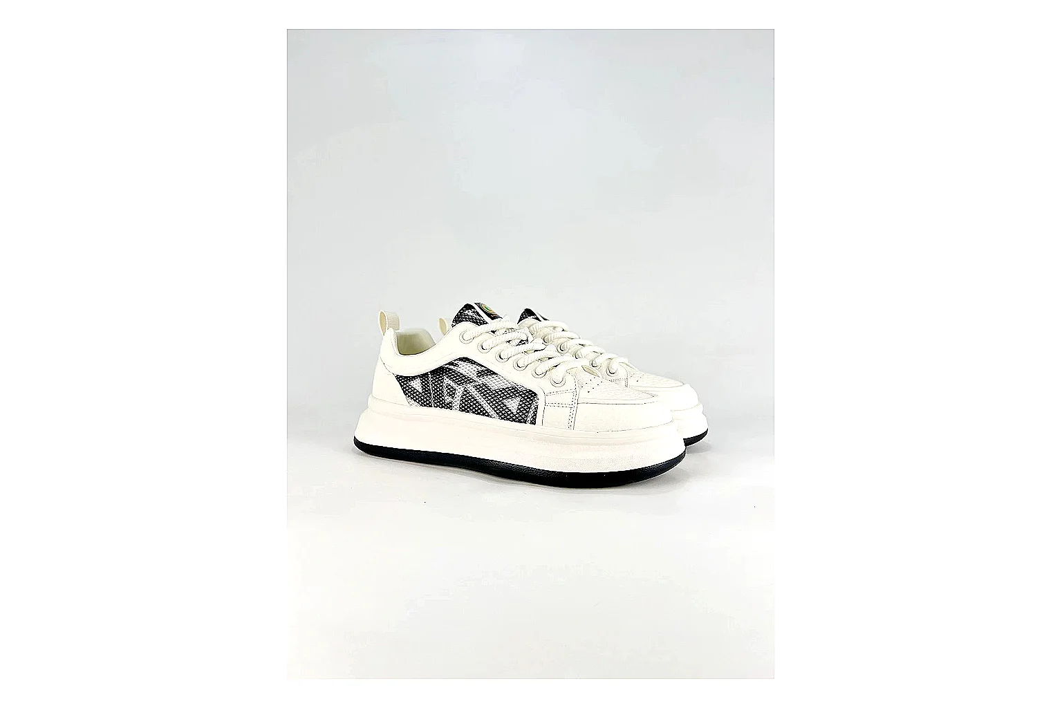 Low Runner White Black Sneaker comparison photo showing white black synthetic low-top upper, minimal runner shape, clean panels, and casual sole