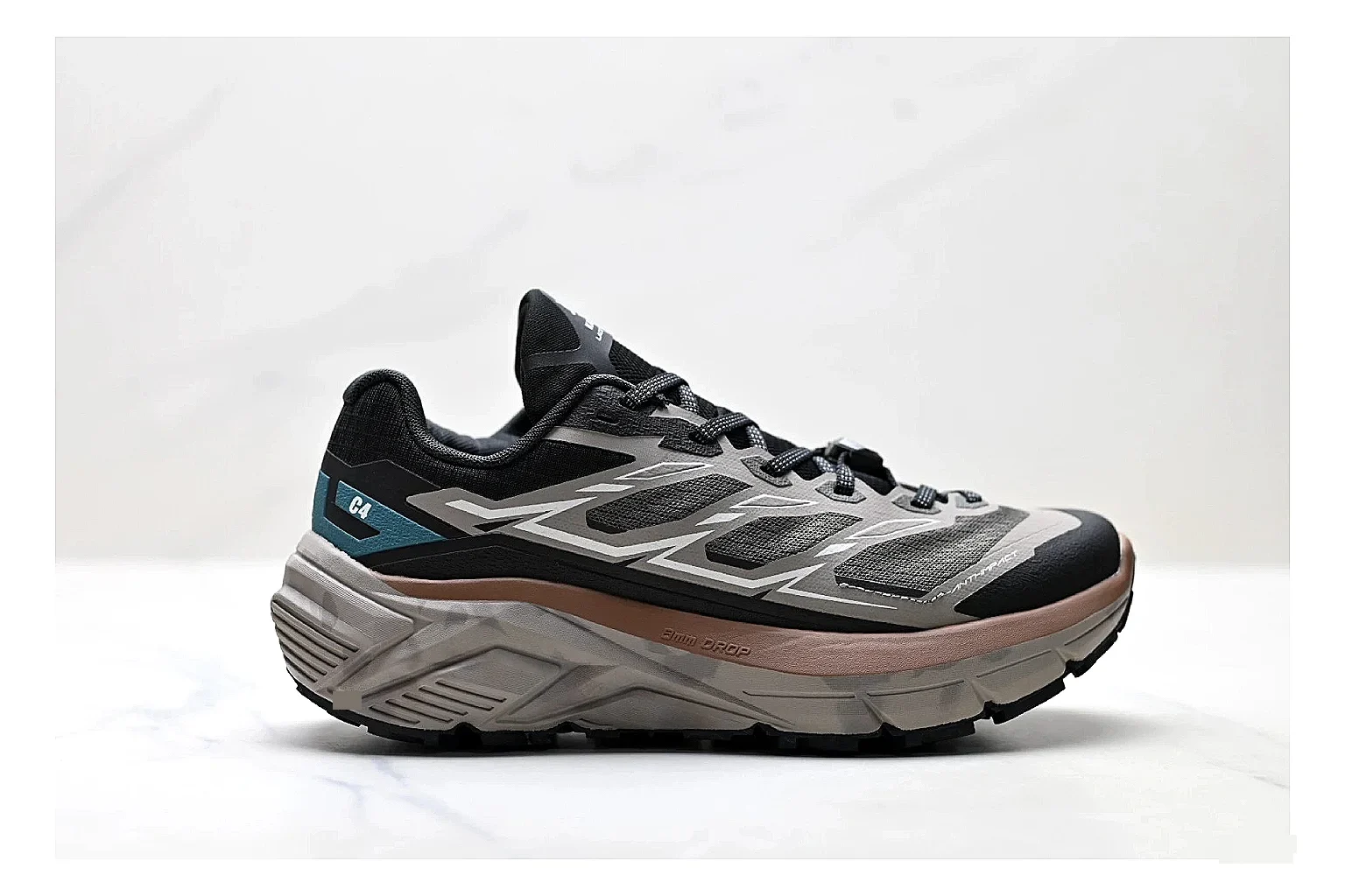 Trail Runner Black Teal Sneaker comparison photo showing black mesh runner upper, teal accent details, rugged trail profile, and traction sole