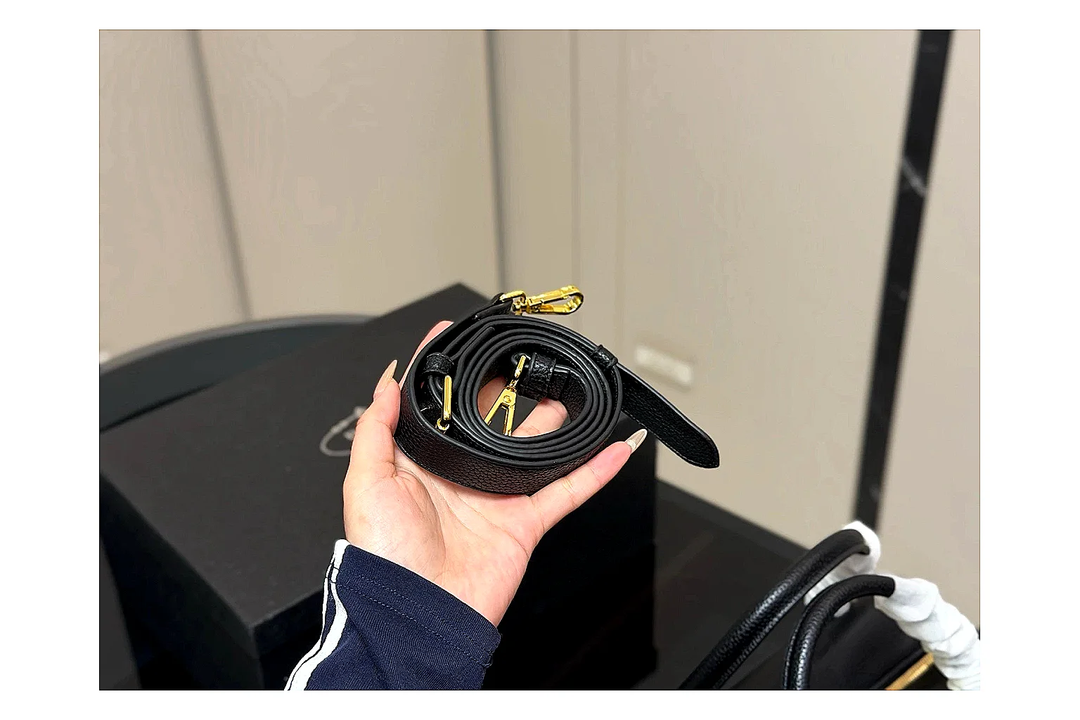 Prada Mini Top Handle Black comparison photo showing black leather mini bag body, structured top handle, compact silhouette, and clean metal hardware thumbnail 3