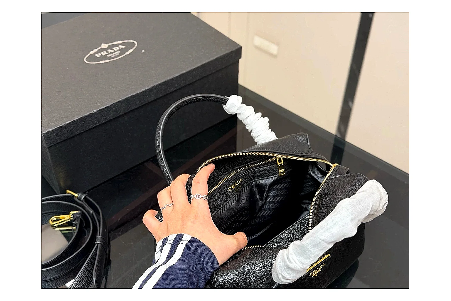 Prada Mini Top Handle Black comparison photo showing black leather mini bag body, structured top handle, compact silhouette, and clean metal hardware thumbnail 4