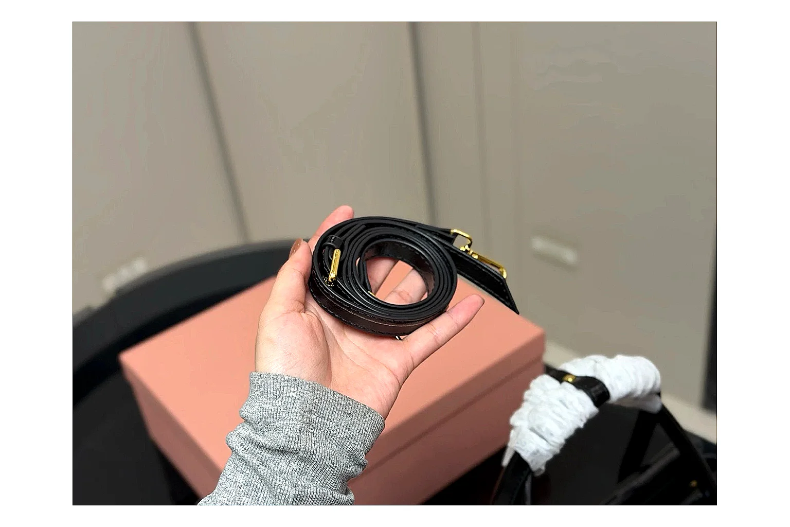 Prada Mini Top Handle Black comparison photo showing black leather mini bag body, structured top handle, compact luxury shape, and clean hardware details thumbnail 3
