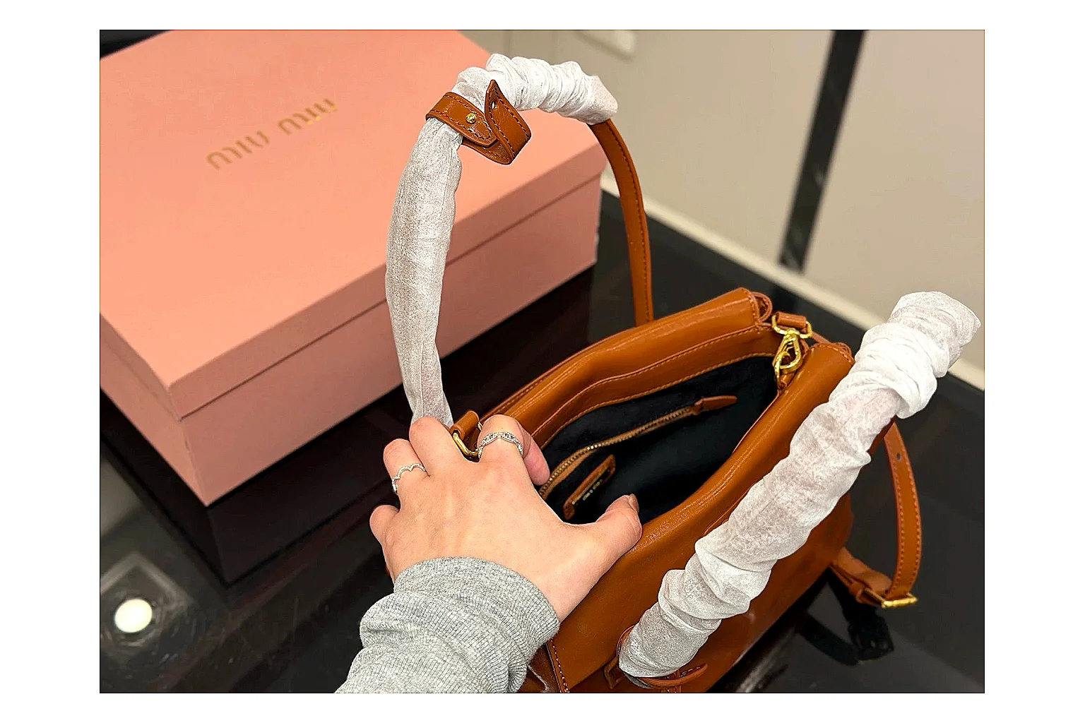 Prada Mini Top Handle Orange Brown comparison photo showing orange brown leather mini bag body, structured top handle, compact shape, and clean hardware details thumbnail 4