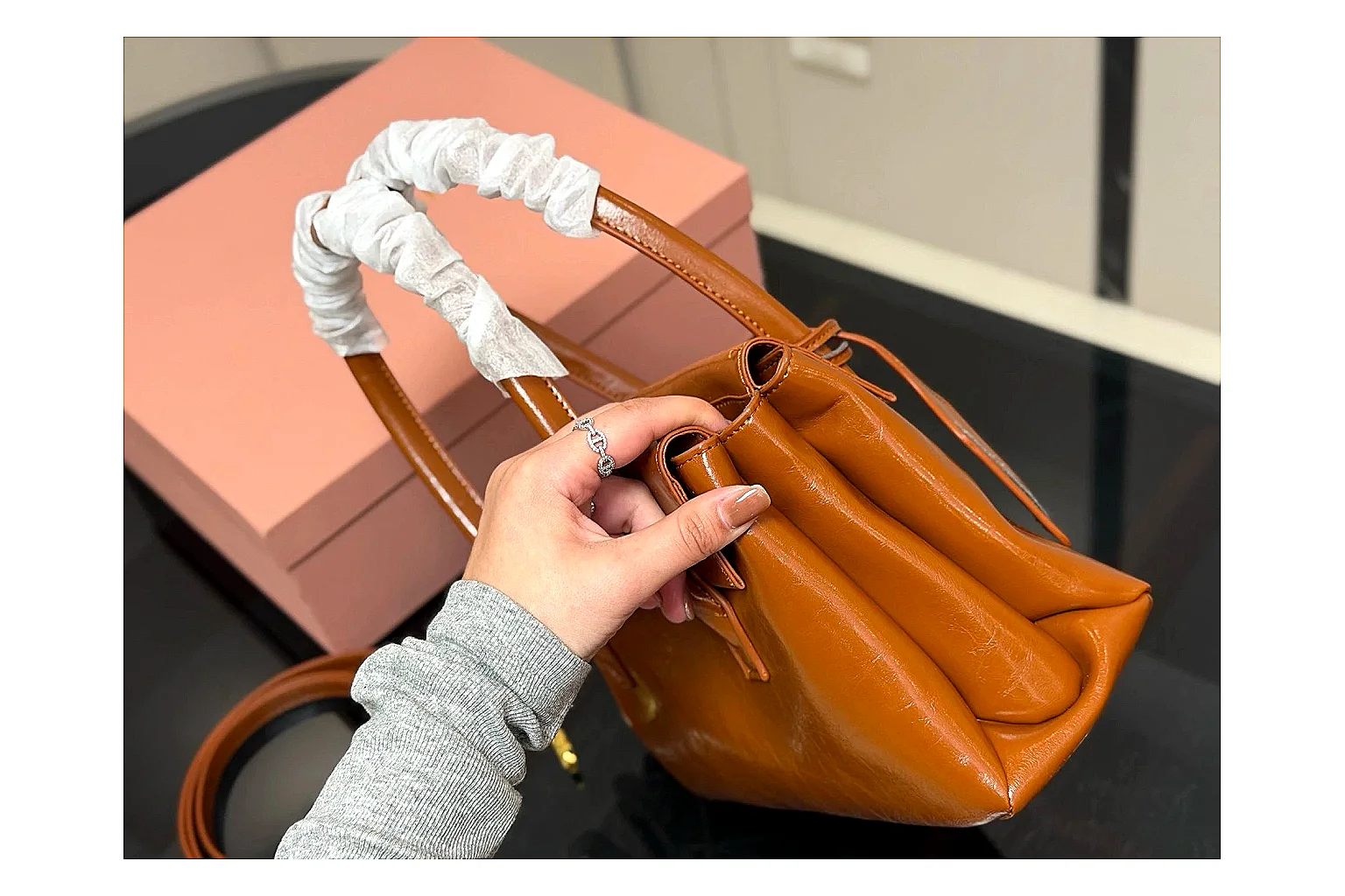 Prada Mini Top Handle Orange Brown comparison photo showing orange brown leather mini bag body, structured top handle, compact shape, and clean hardware details thumbnail 5