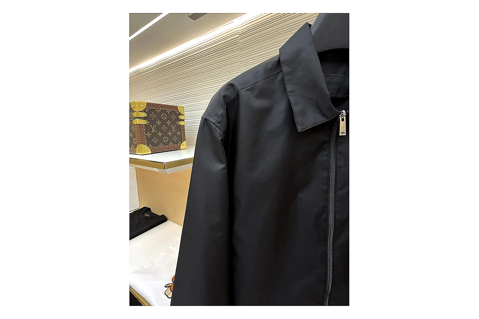 Prada Re-Nylon Hooded Jacket Black Jacket comparison signal photo with black Re-Nylon hooded jacket with recycled-nylon texture, hood structure, zipper line, sleeve cuffs, and light shell shape thumbnail 3