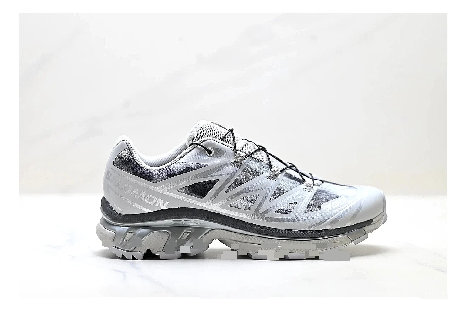 Salomon Xt Runner Silver Gray comparison photo showing silver gray mesh trail upper, technical runner overlays, speed-lace style structure, and rugged sole