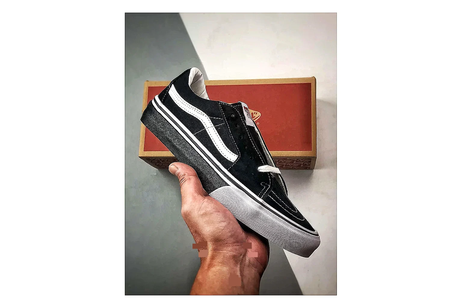 Vans Old Skool Black White comparison photo showing black canvas-suede low-top upper, white side stripe, padded collar, and classic vulcanized skate sole