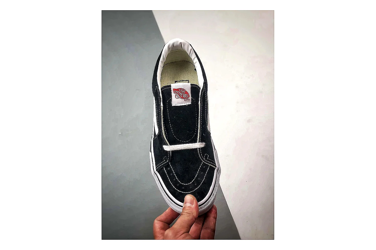 Vans Old Skool Black White comparison photo showing black canvas-suede low-top upper, white side stripe, padded collar, and classic vulcanized skate sole thumbnail 6